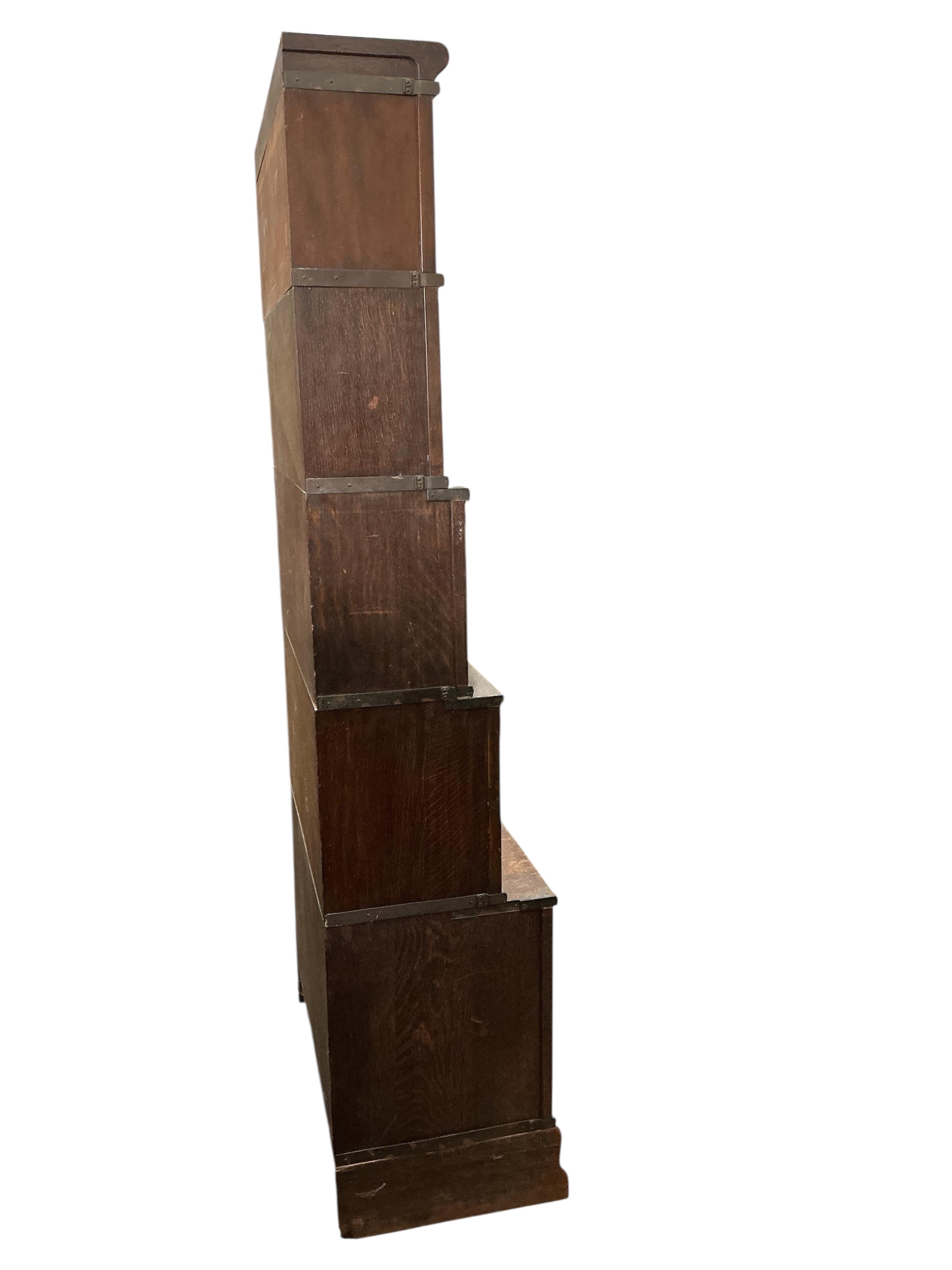 A Globe Wernicke oak five section bookcase, two sections missing glass panels, width 86cm, depth 46cm, height 220cm